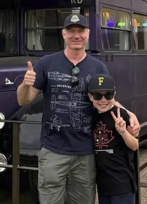Join the Fray host Fraser, 10, and his producer dad Chris giving a peace sign and a thumbs up