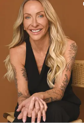 Karen Hoekstra, founder and CEO of K-Pure Naturals skincare, smiling in a studio portrait